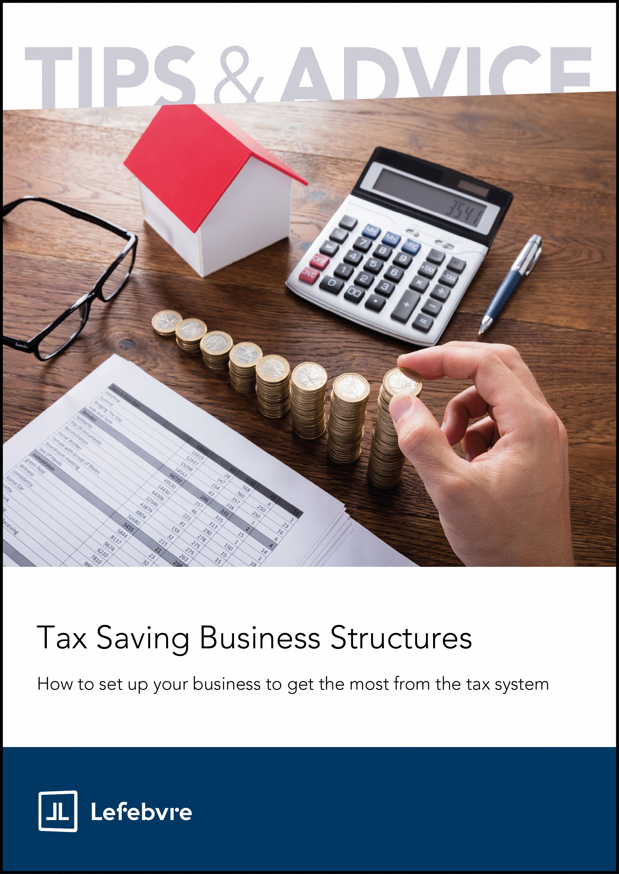 Book cover with tax-saving business structures theme, calculator, coins, and paperwork on a wooden table.